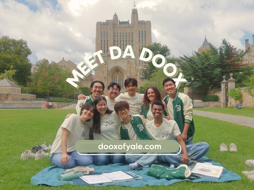 Meet Da Doox: members posing on a picnic blanket at Yale in green and cream shirts